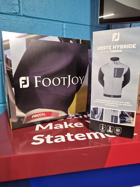 An image of tabletop signage on a FASTSIGNS podium.